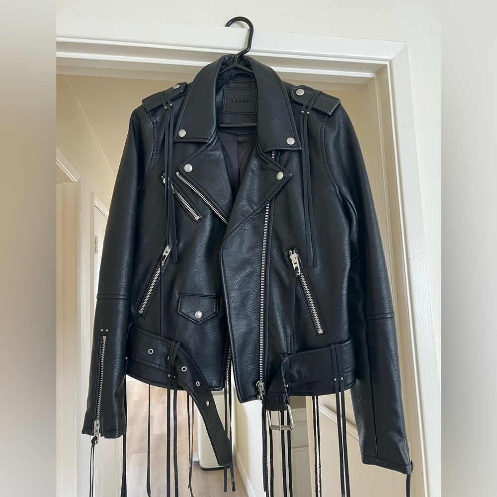 Black leather jacket with tassels